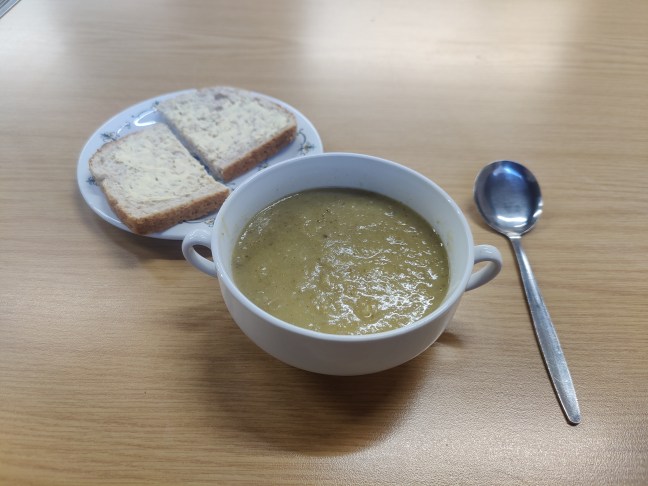 Bowl of home-made soup with buttered bread